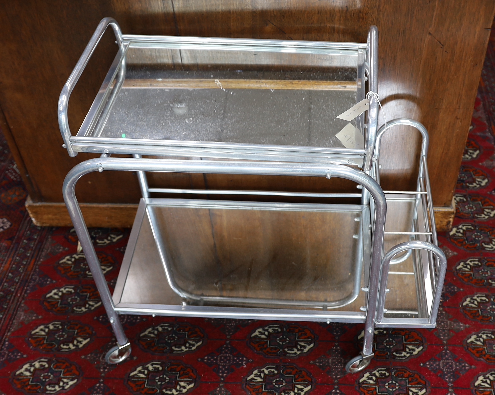 A mid century French mirrored two tiered drinks trolley, width 72cm, depth 40cm, height 72cm